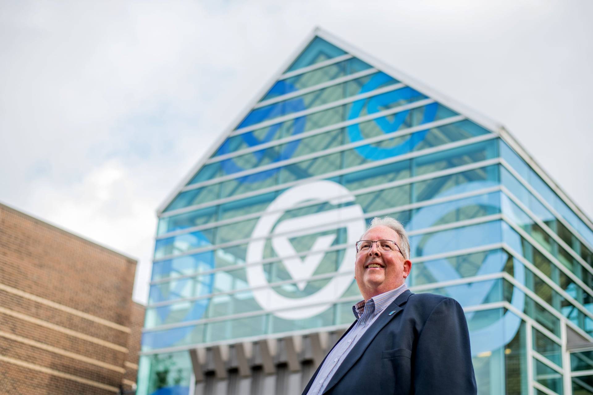 Bob Stoll with Kirkhof Center in background